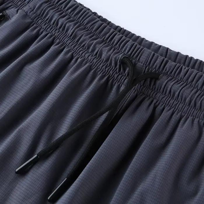 Pánske športové šortky s rýchloschnúcim materiálom a zipsovými vreckami