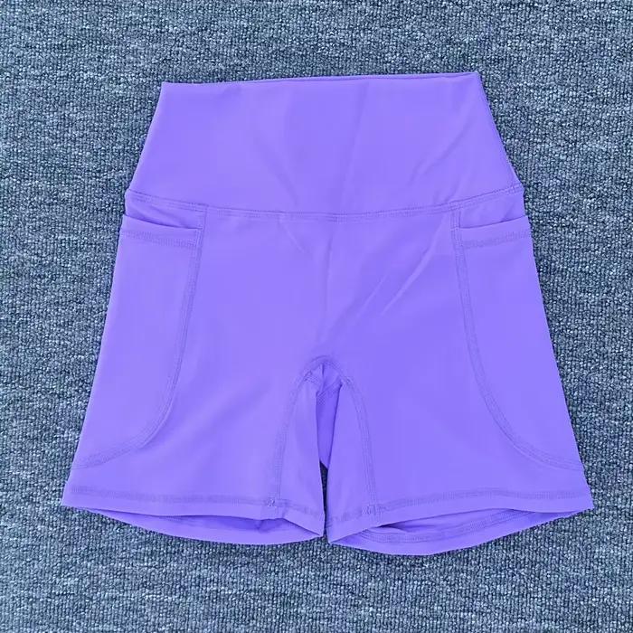 Shorts sportifs pour femmes en nylon et élasthanne avec poche droite pour yoga et fitness
