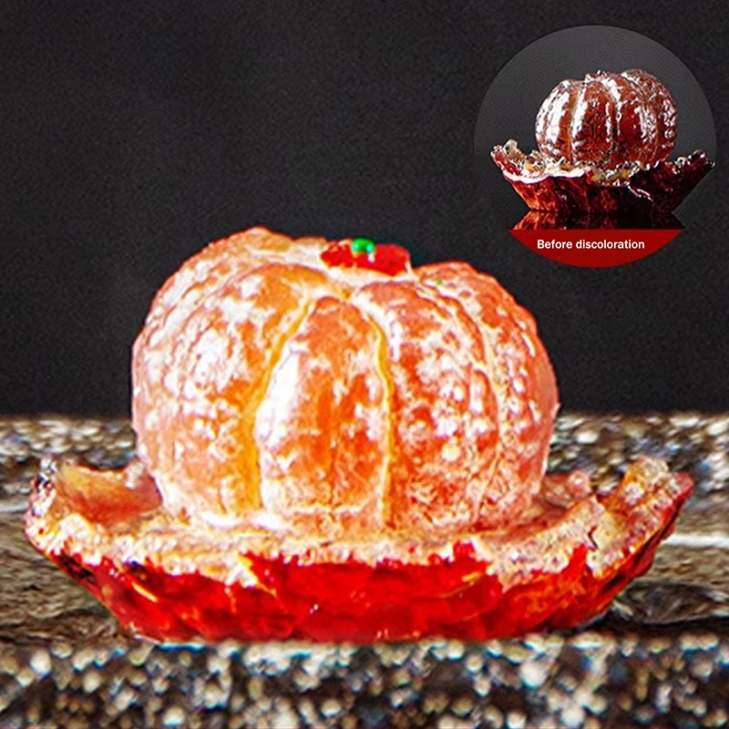Un animal de thé qui change de couleur en forme d'un mandarine, en résine, parfait comme un beau cad