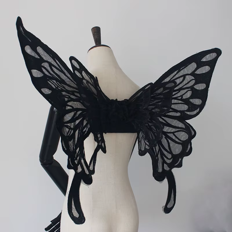 Les ailes de papillon noires et blanches originales faites à la main peuvent être portées par Miss L